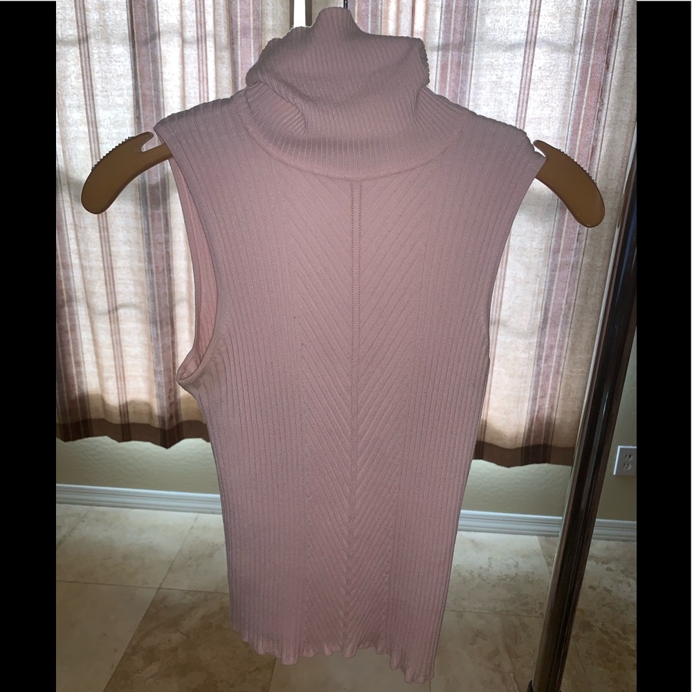 Pink sleeveless turtleneck